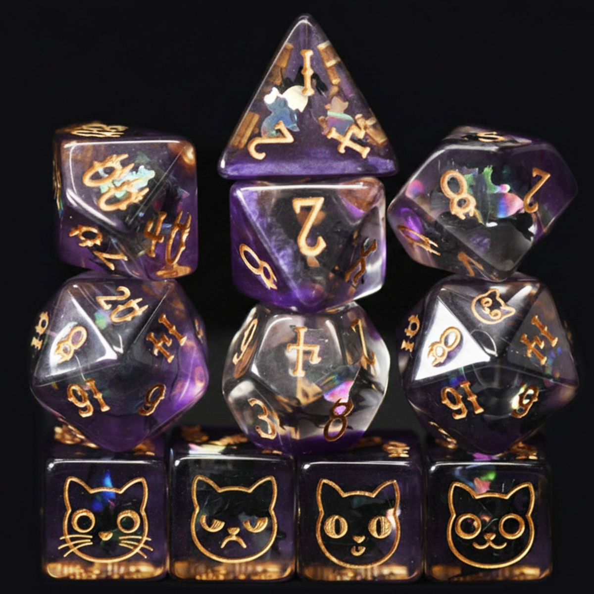 Set of dice with cat faces and gold numbers on a black background
