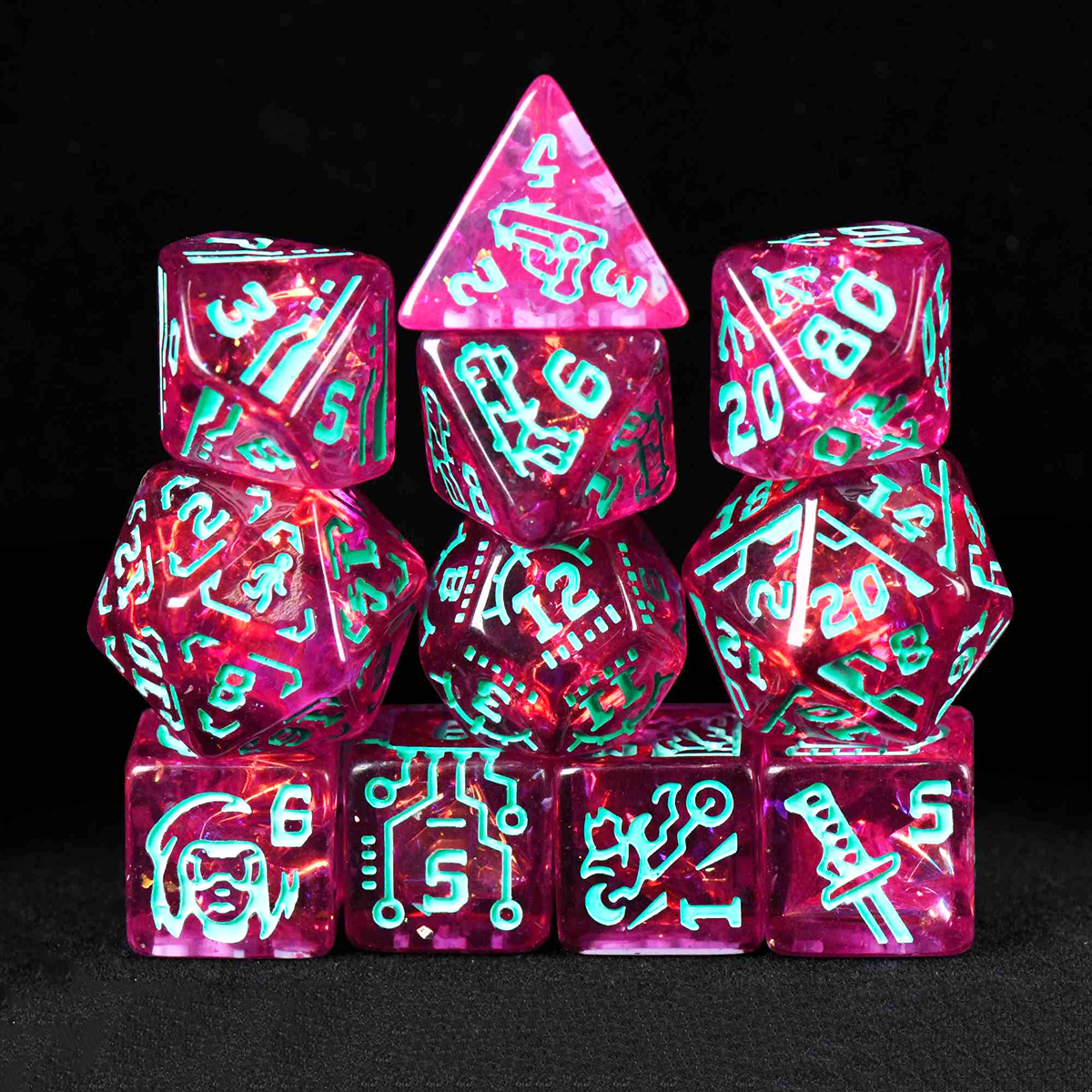 Set of pink and green dice with glowing numbers on a black background