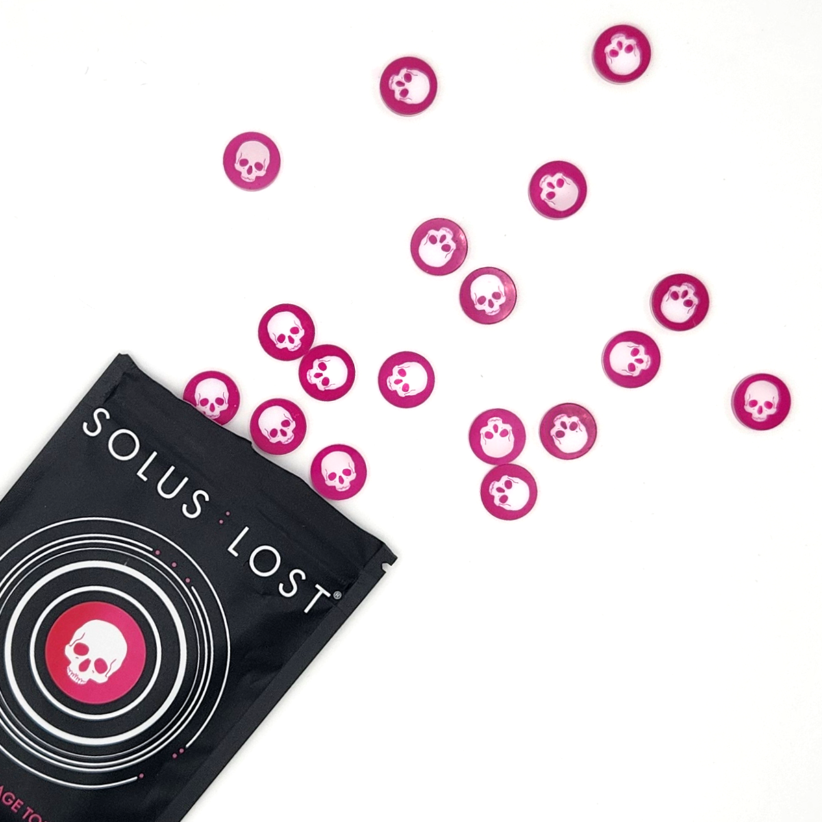 A black pouch labeled 'SOLUS LOST' with a skull graphic, shown on a white background with several scattered pink circular tokens featuring white skulls.